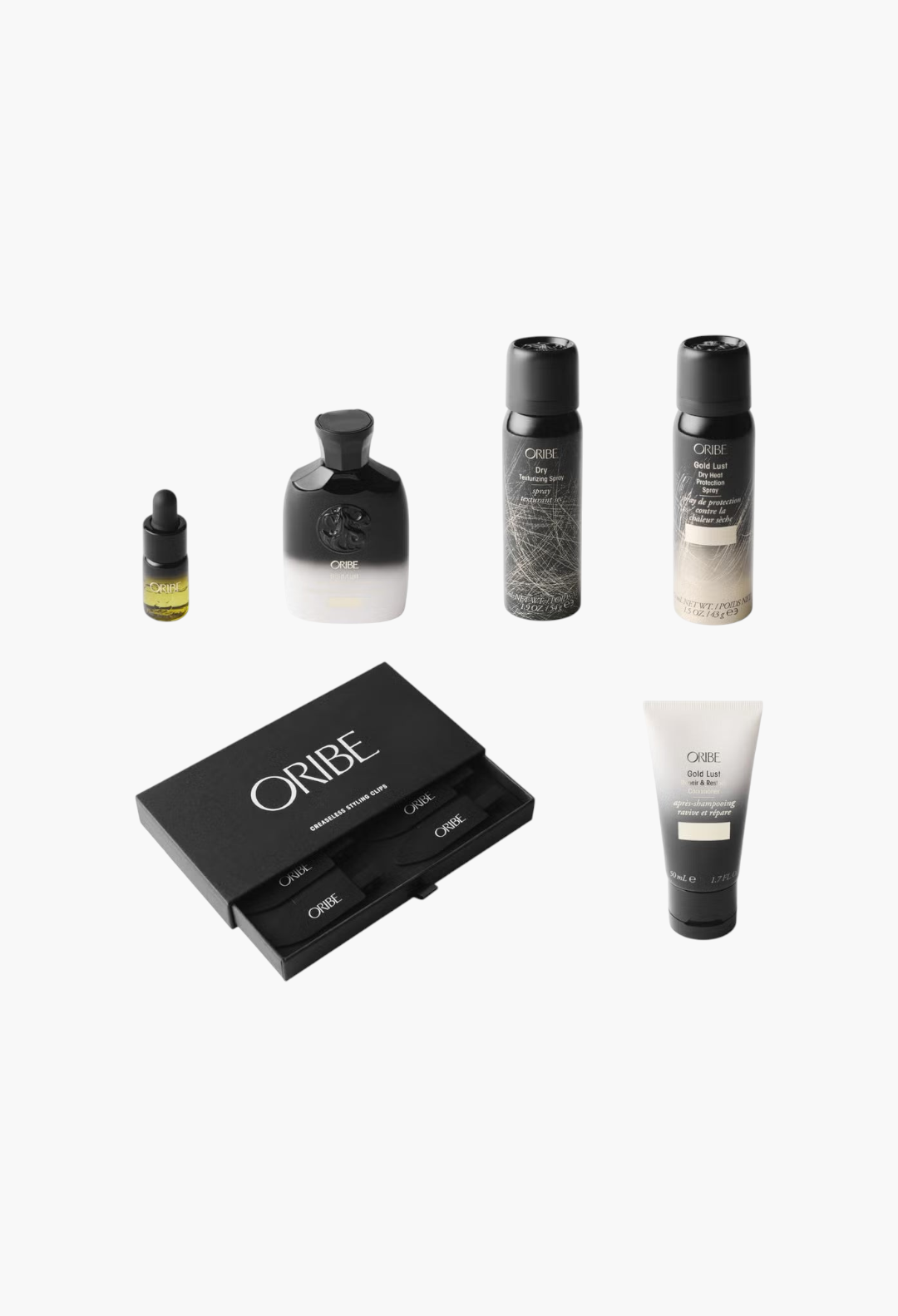 GLAM MODA Oribe haircare set featuring travel-sized Gold Lust shampoo, conditioner, oil, sprays, and creaseless clips.