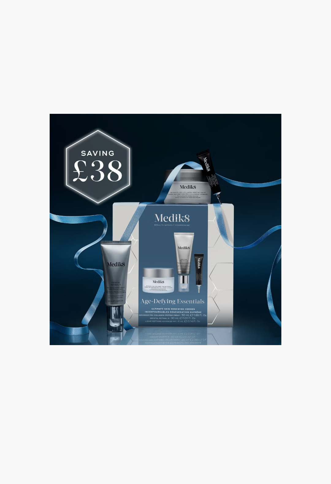 GLAM MODA Medik8 Age-Defying Essentials skincare gift set featuring anti-aging cream, retinal serum, and peptide serum.