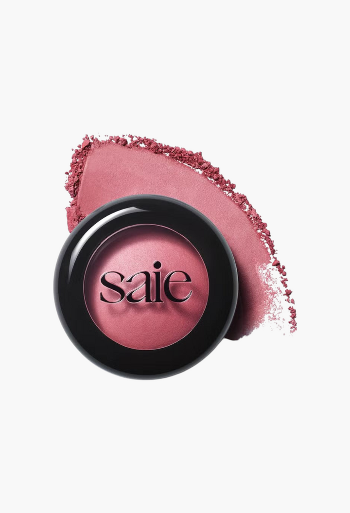 GLAM MODA Saie SuperSuede Radiant Blush in a pink shade with a smooth baked powder texture and black compact case.