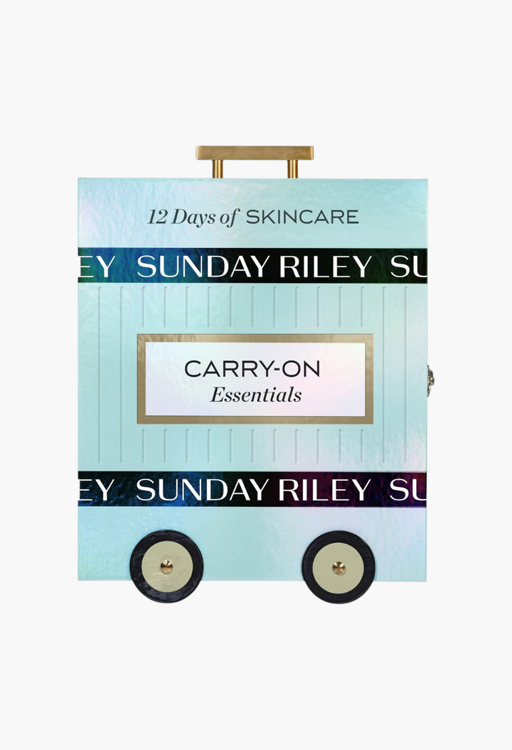 GLAM MODA Sunday Riley 12 Days of Sunday skincare advent calendar in a light blue carry-on suitcase design.