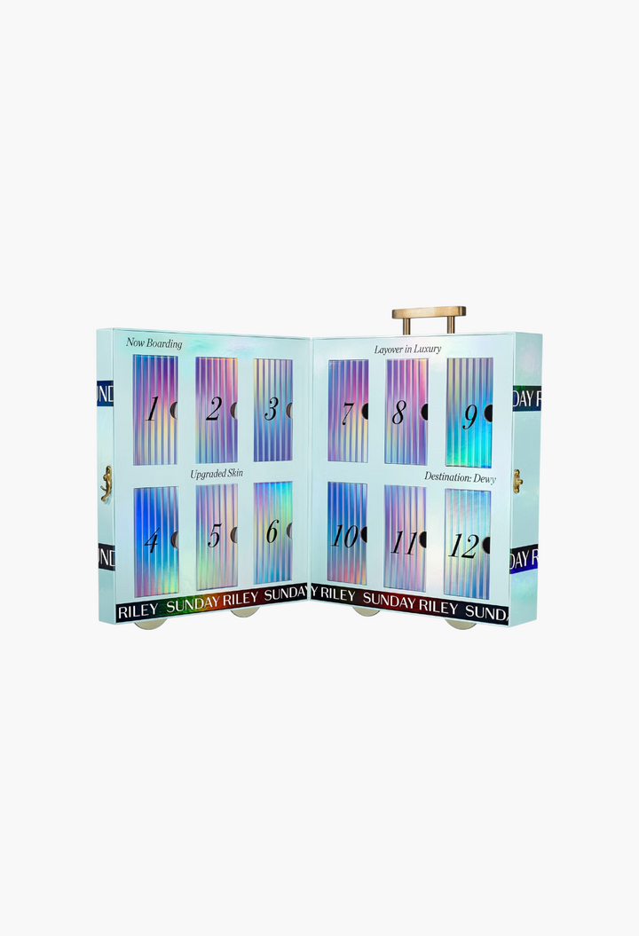 GLAM MODA Sunday Riley 12 Days of Sunday skincare advent calendar with numbered doors in a travel-themed box.