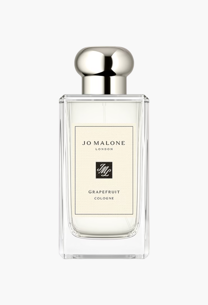 GLAM MODA Grapefruit Cologne in a clear glass bottle with a silver cap, featuring notes of rosemary and peppermint.