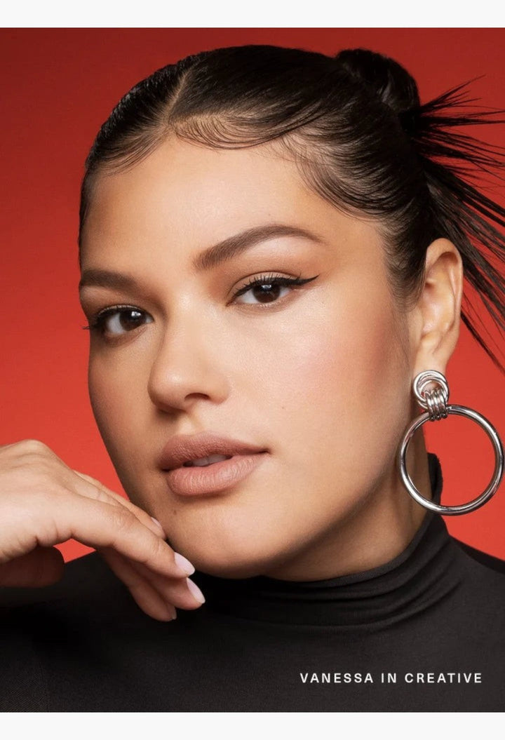 GLAM MODA Kind Words Matte Lip Liner in Creative shade on a model with neutral makeup and silver hoop earrings