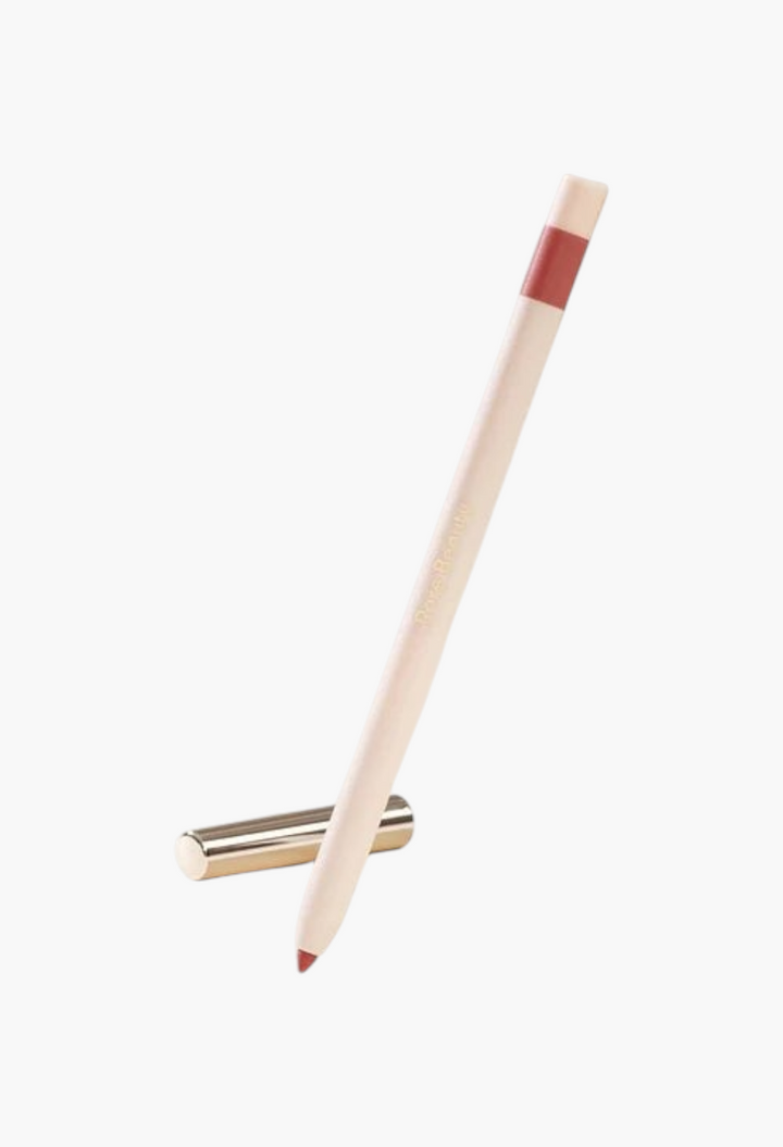GLAM MODA Kind Words matte lip liner in a neutral rose shade with a sleek beige pencil body and gold cap.