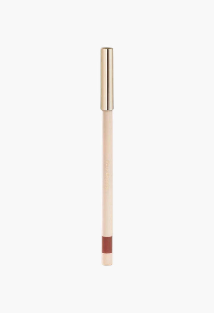 GLAM MODA Kind Words matte lip liner in a neutral brown shade with a sleek gold cap and retractable design.