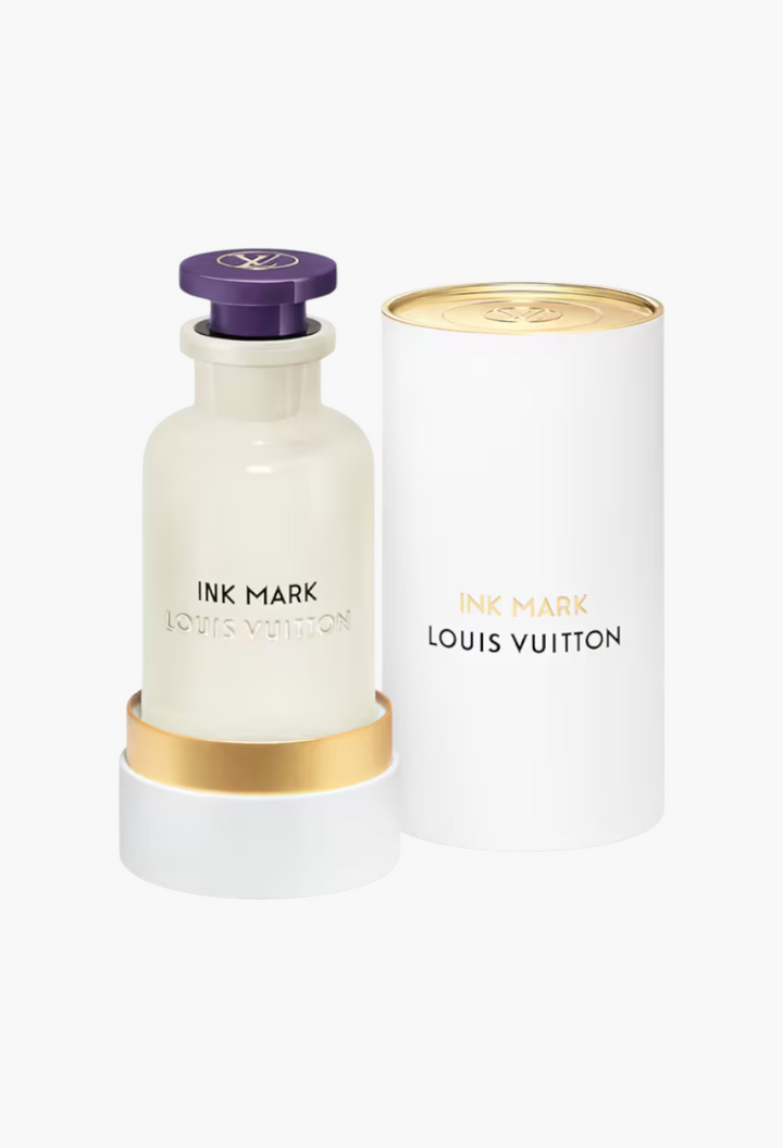 GLAM MODA Louis Vuitton Ink Mark perfume bottle with opalescent glass, purple cap, and white cylindrical gift case.
