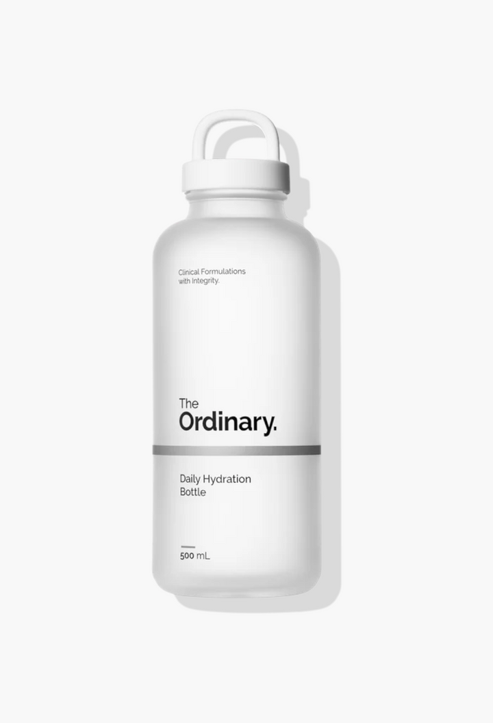 GLAM MODA 500ml frosted glass Daily Hydration Bottle with a white screw cap and minimalist branding.