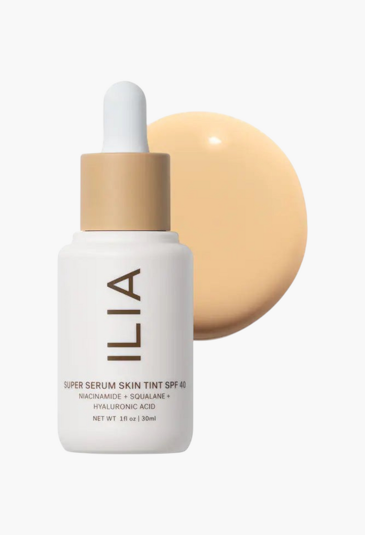 GLAM MODA ILIA Super Serum Skin Tint SPF 40 liquid foundation bottle with a swatch of light beige radiant formula