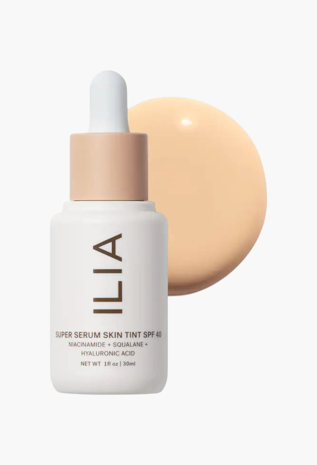 GLAM MODA ILIA Super Serum Skin Tint SPF 40 bottle with a swatch of light liquid foundation on a white background