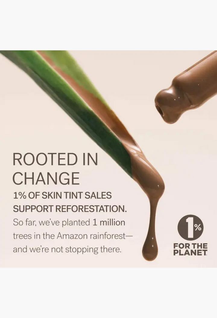 GLAM MODA Super Serum Skin Tint liquid foundation dripping from a dropper with a 1% for the Planet reforestation note