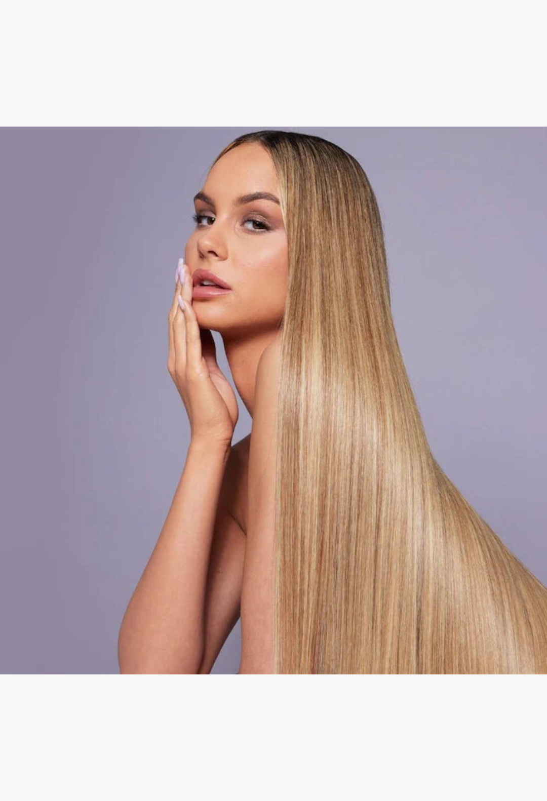 GLAM MODA Dream Coat anti-frizz spray creates sleek, glossy, and straight hair on a model with long blonde hair