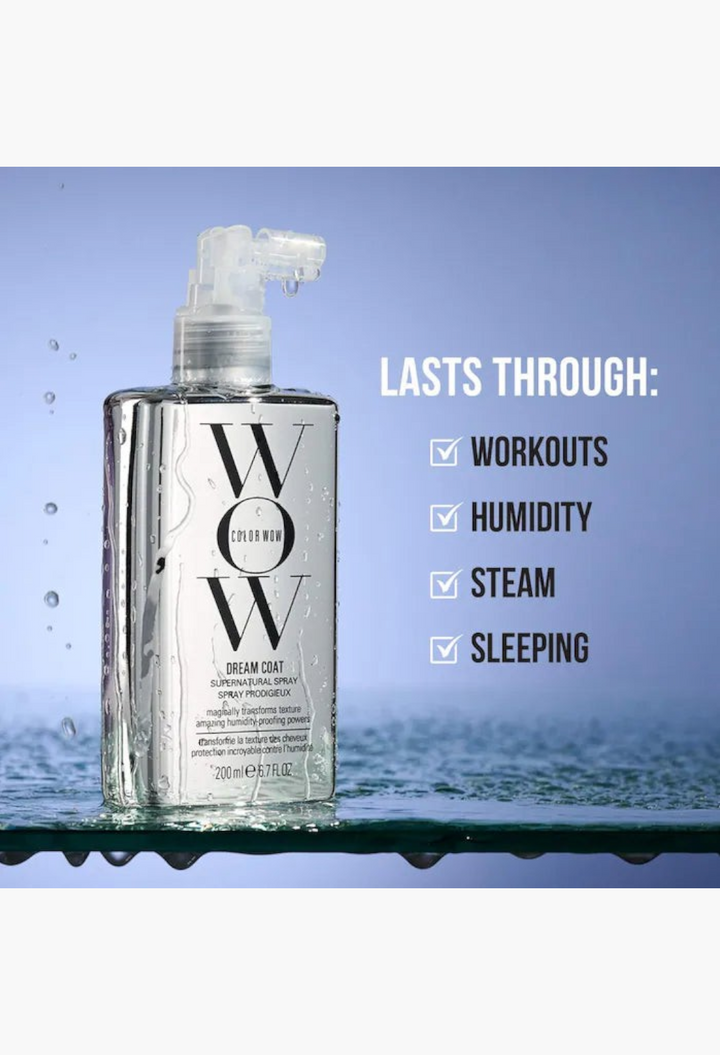 GLAM MODA Dream Coat anti-frizz spray bottle on a wet surface with water droplets, highlighting humidity protection.