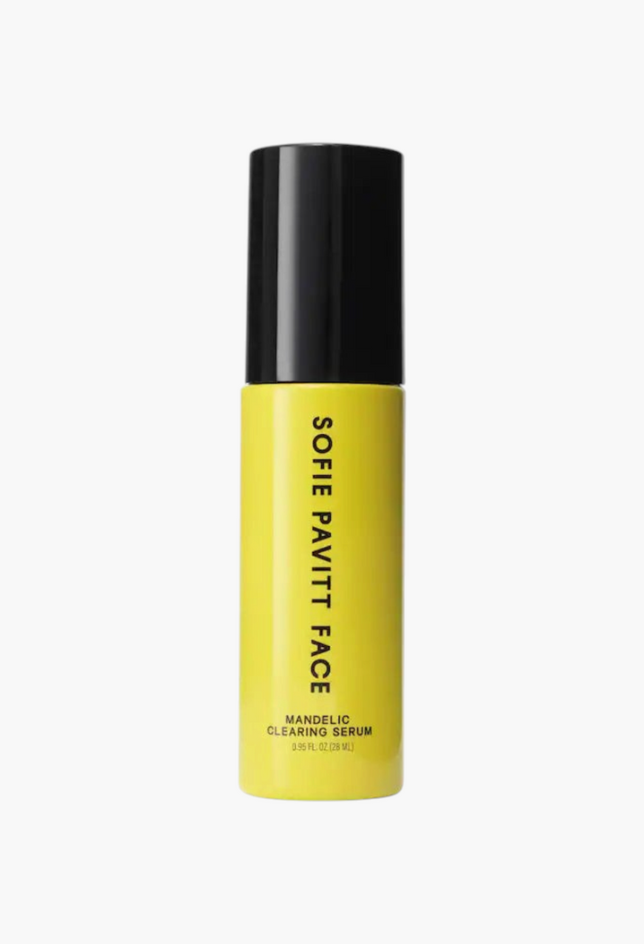GLAM MODA Sofie Pavitt Face Mandelic Acid exfoliating and clearing serum in a bright yellow bottle with black cap.