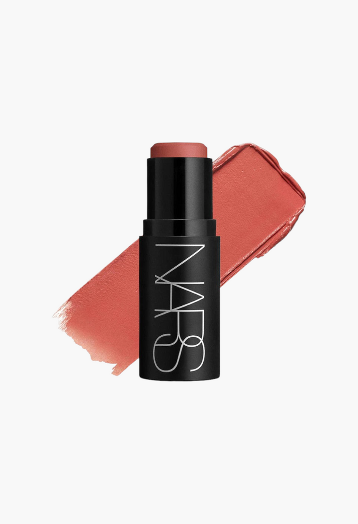 GLAM MODA NARS Multiple Soft Blur blush stick in a warm rose shade with a creamy texture swatch on a white background