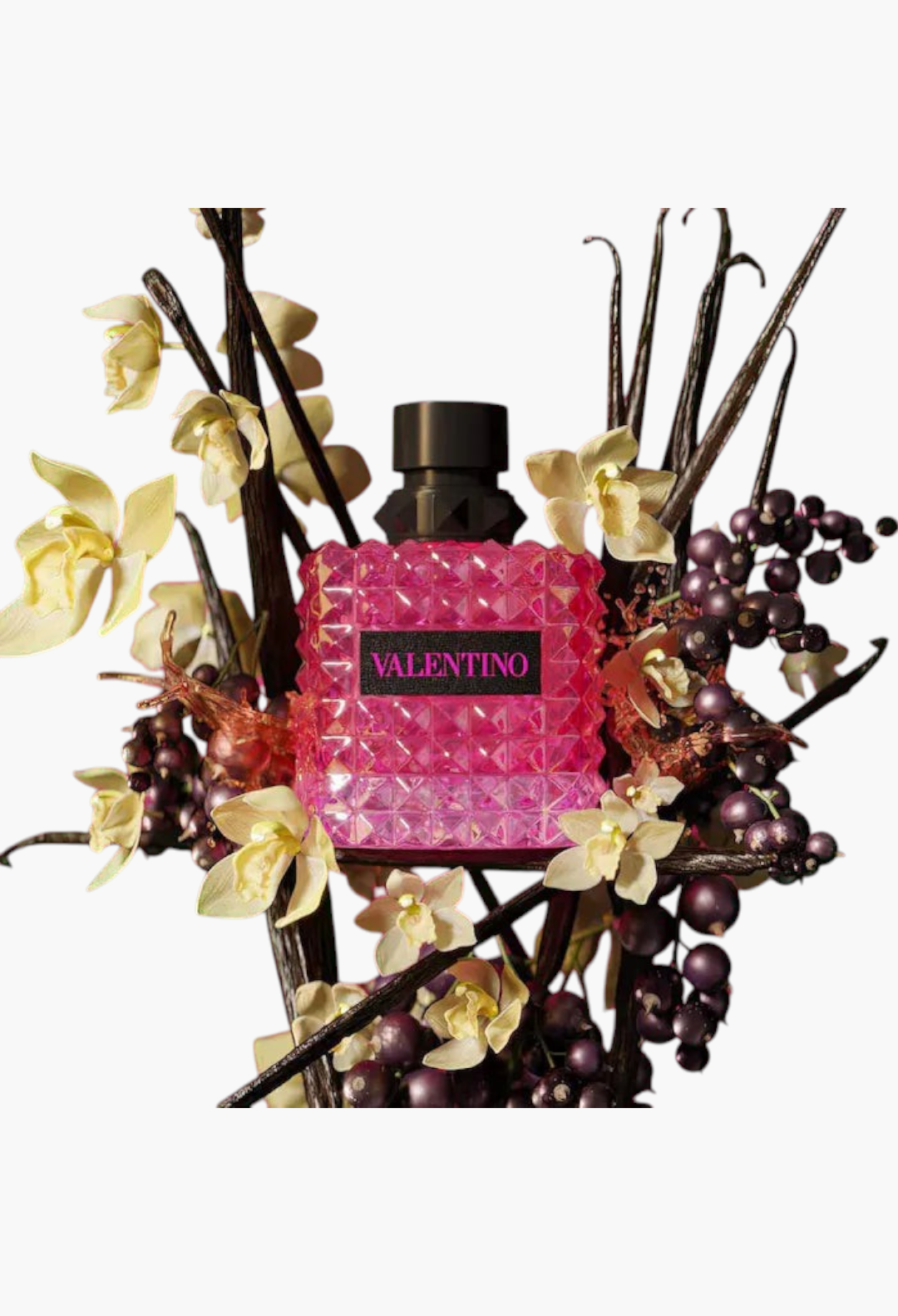 GLAM MODA perfume sampler set featuring a pink Valentino Donna Born in Roma bottle surrounded by floral accents.