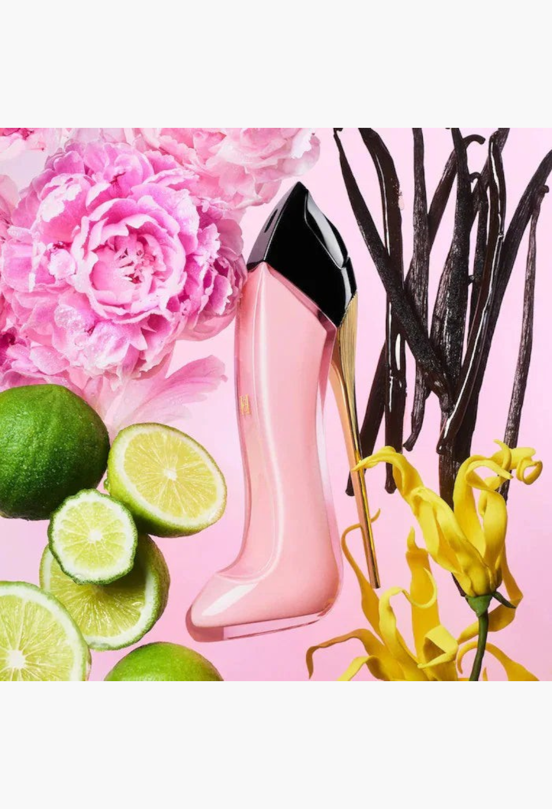 GLAM MODA perfume bottle shaped like a pink stiletto heel surrounded by fresh lime slices, pink peonies, and vanilla beans.