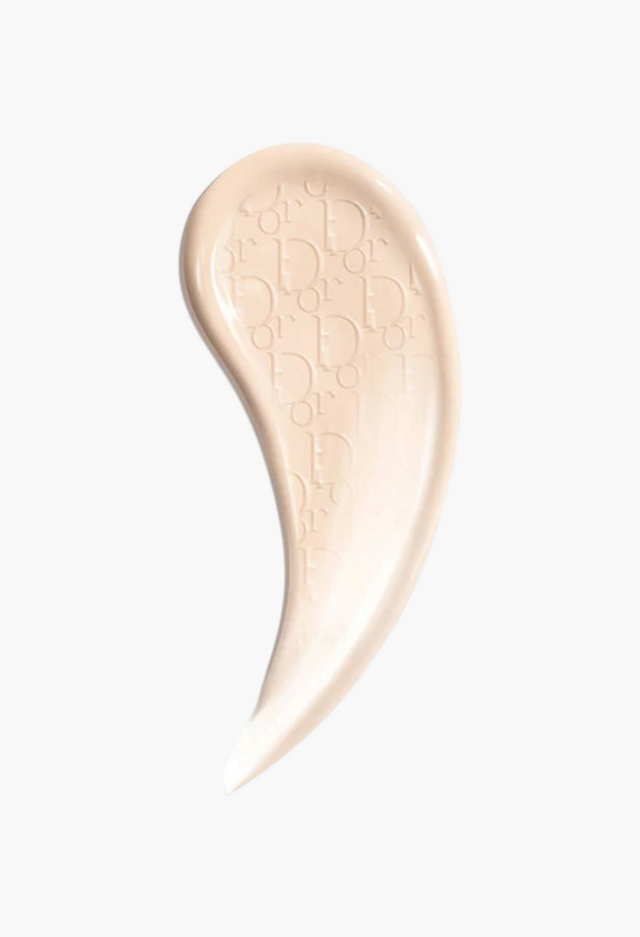 GLAM MODA Dior Backstage Glow-Up Skin Tint swatch showing light beige liquid texture with embossed logo detail