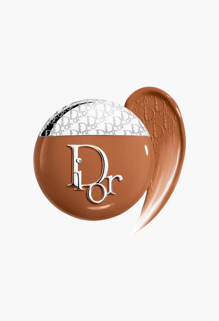 GLAM MODA Dior Backstage Glow-Up Skin Tint in a deep shade with a swatch showing natural finish and liquid texture.