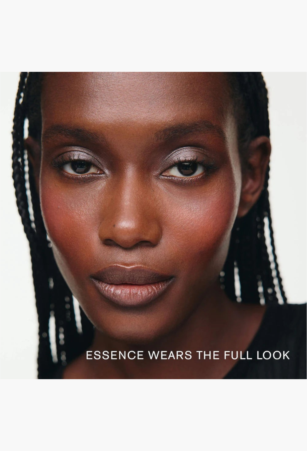 GLAM MODA model wearing a soft glowy makeup look from the MERIT x Erdem gift set with shimmering eyeshadow and blush