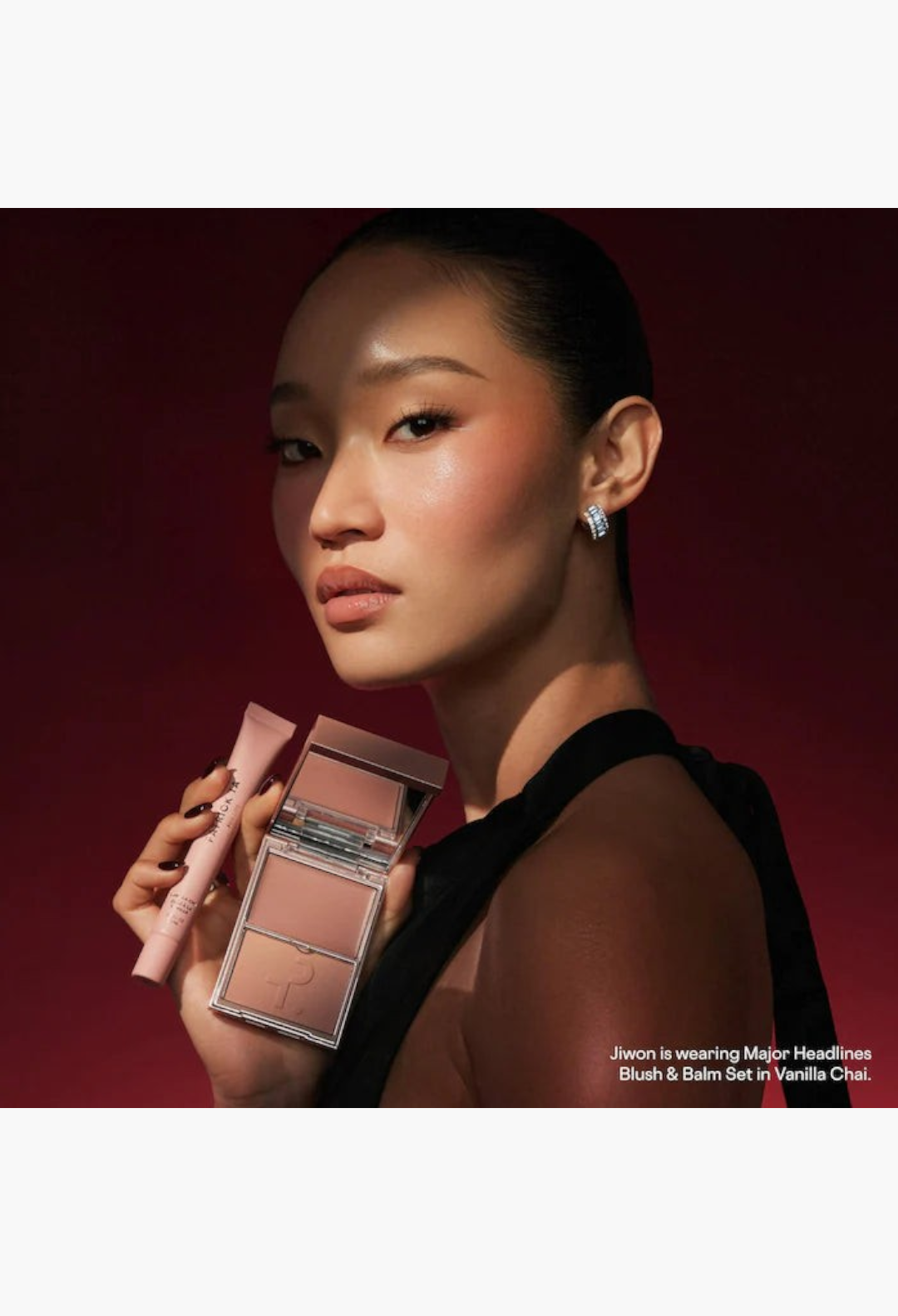 GLAM MODA model wearing rosy pink blush and lip balm from the Major Headlines holiday makeup gift set