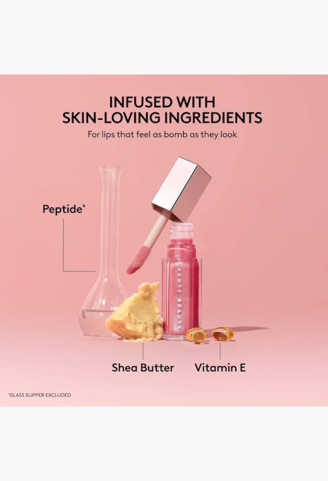 GLAM MODA Gloss Bomb lip luminizer with peptide, shea butter, and vitamin E ingredients on a pink background