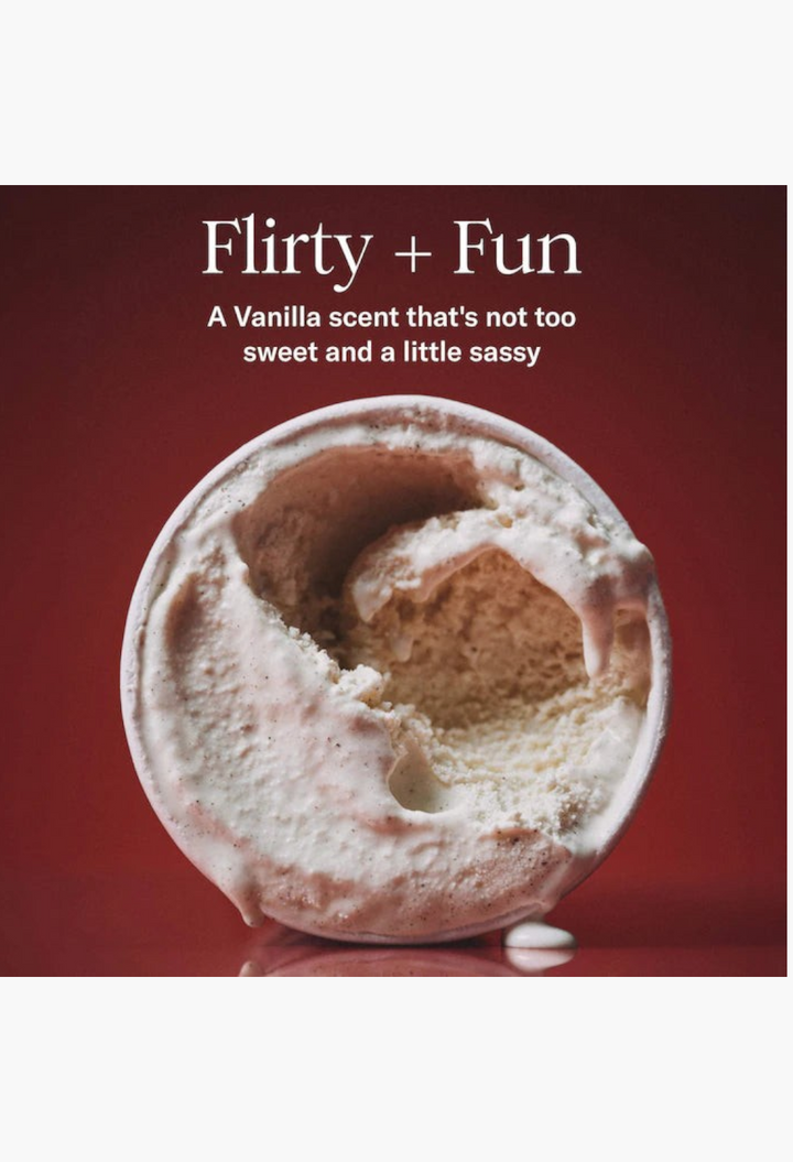 GLAM MODA Vanilla Vibezzz whipped body butter with a creamy texture in an open jar against a deep red background