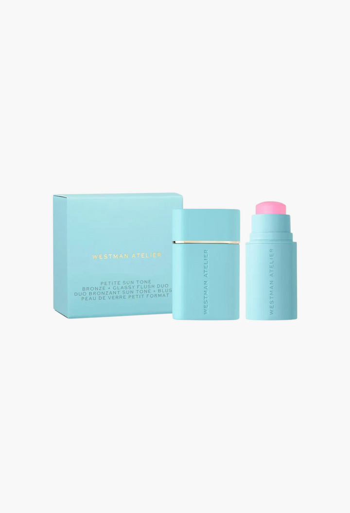 GLAM MODA Westman Atelier Petite Sun Tone Bronze and Glassy Flush pH-adaptive blush stick set in light blue packaging.
