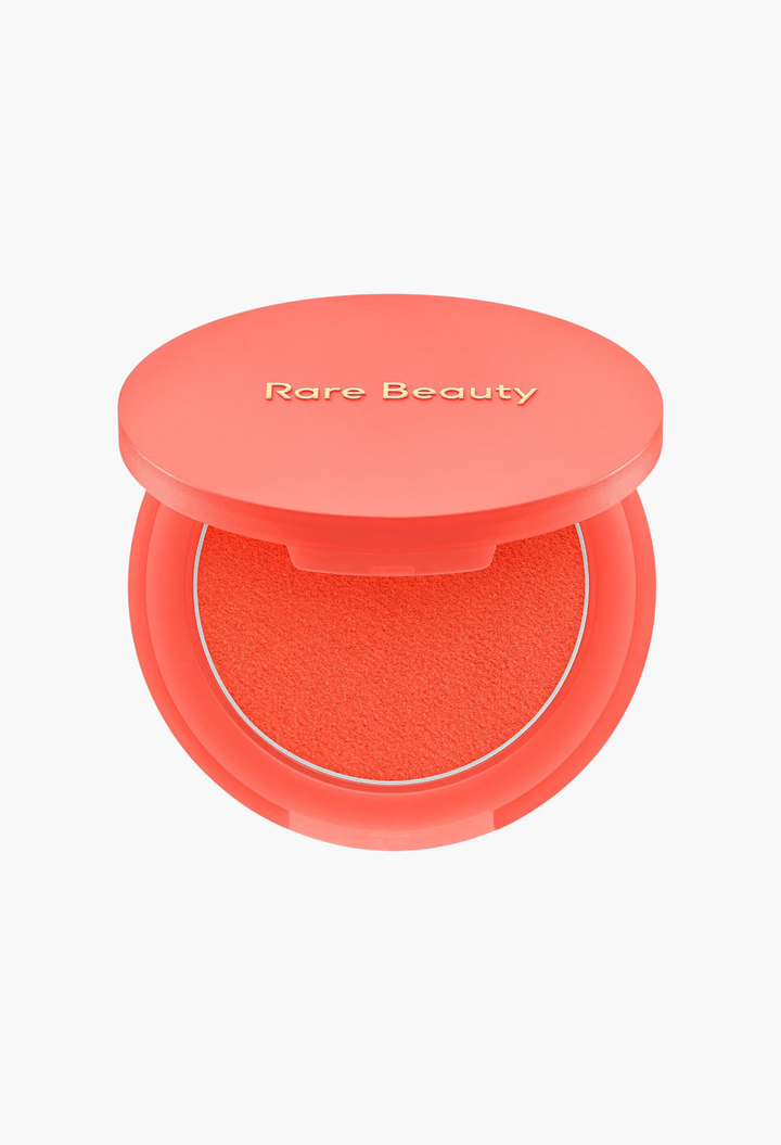 GLAM MODA Soft Pinch Matte Bouncy Blush in a vibrant coral shade with a smooth, putty-like texture in a round compact