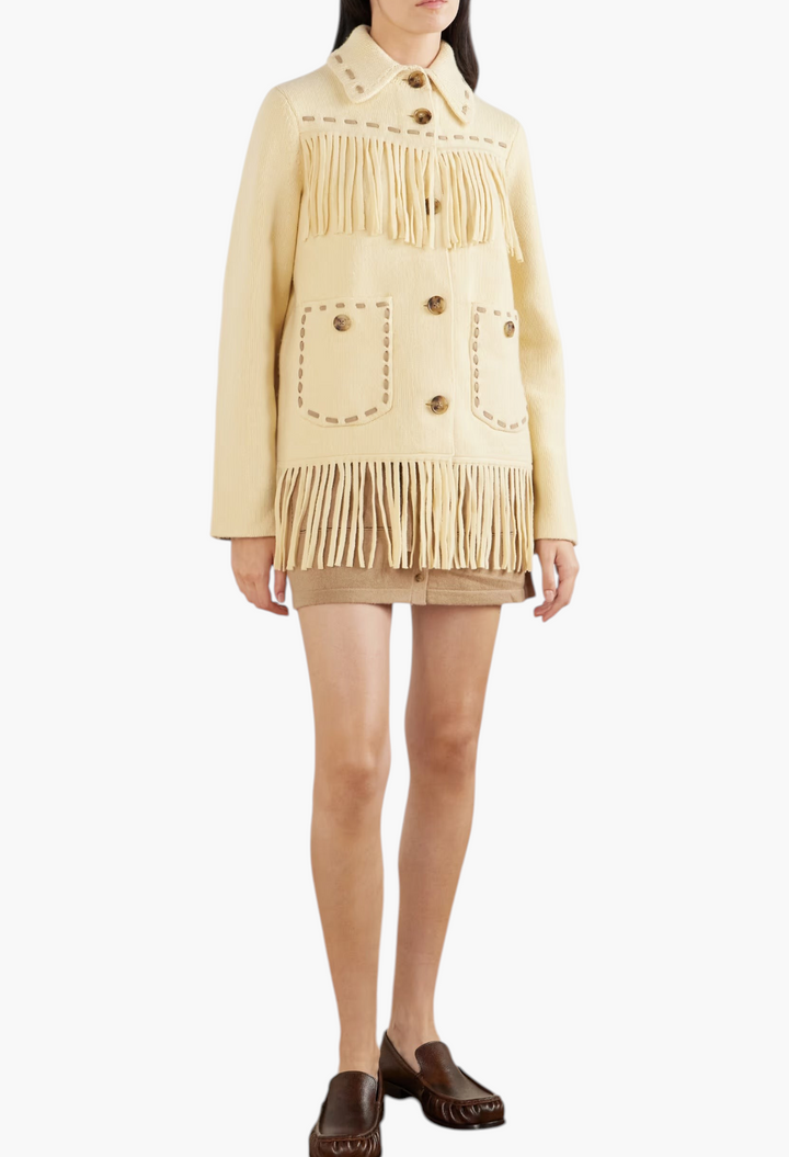 GLAM MODA yellow wool-blend Western jacket with long fringe, stitched trims, and button-down front on a model
