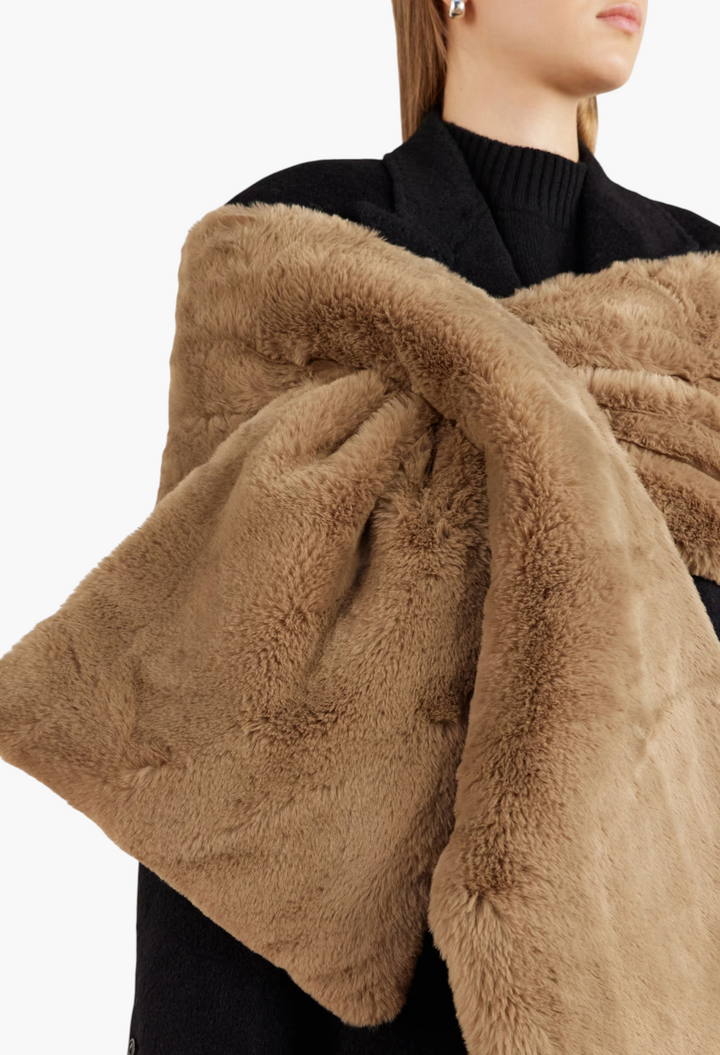 GLAM MODA Piacere plush brown faux fur scarf with a bow-shaped slot-through fastening worn over a black coat