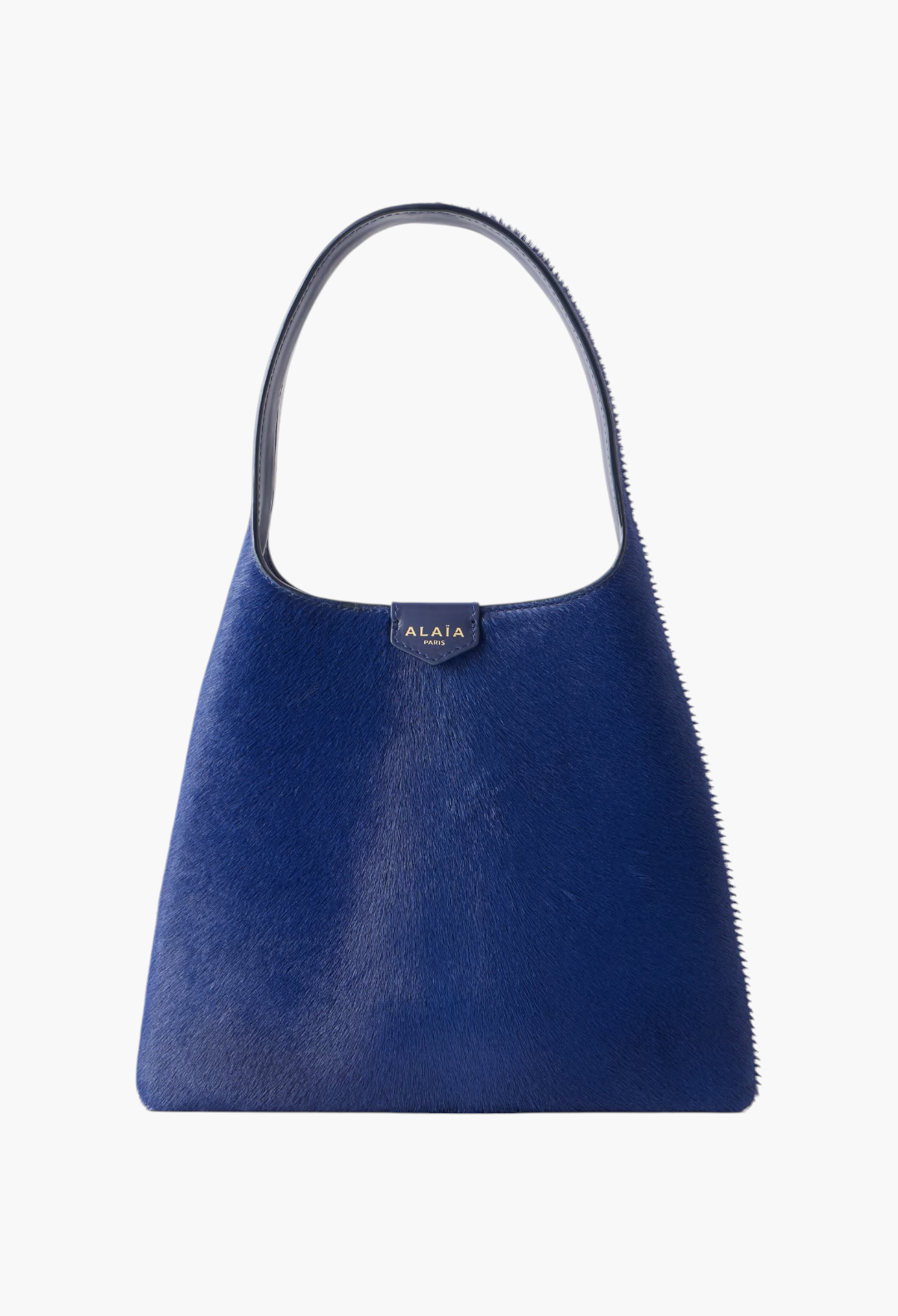 GLAM MODA Alaïa mini shoulder bag in vibrant blue calf hair with a slouchy silhouette and leather shoulder strap.